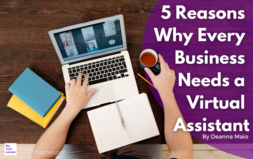 A person is sitting at a wooden desk using a laptop to participate in a video conference. Several participants are visible on the laptop screen. The person’s left hand is on the keyboard while their right hand holds a coffee cup. Open notebooks and colorful folders lie on the desk. On the right side of the image, bold white text reads, "5 Reasons Why Every Business Needs a Virtual Assistant" by Deanna Maio. At the bottom left corner, "thevividwoman.com" is visible.